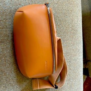 Monos Metro Sling- vegan leather crossbody. Terrific storage; rich tan color